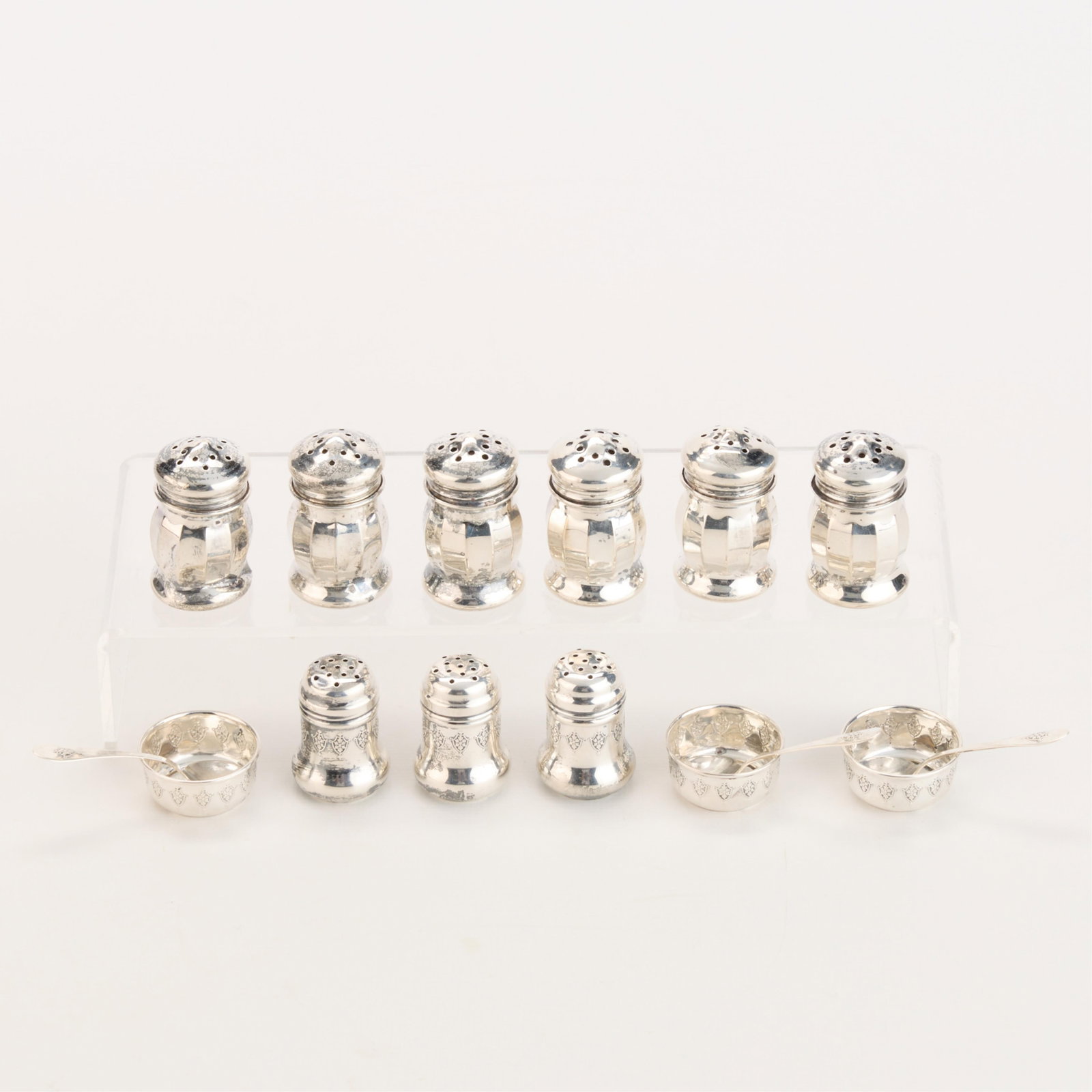 15 Sterling Silver Salt & Pepper Vessels 2.03 ozt: Group of 15 American sterling silver salt and pepper vessels. Including three salt cellars, three salt spoons, and nine shakers. Each marked "Sterling." (Spoons, each) Length: 2 1/8 in. (Salt Cellars 