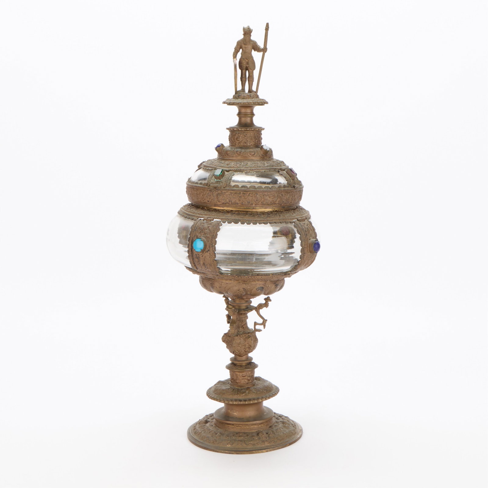 Late 19th c. German Renaissance Style Lidded Cup: Late 19th century German Historicism parcel gilt brass and rock crystal Renaissance-style reproduction of a covered goblet or reliquary vessel. Surmounted by a figural finial depicting a German soldie