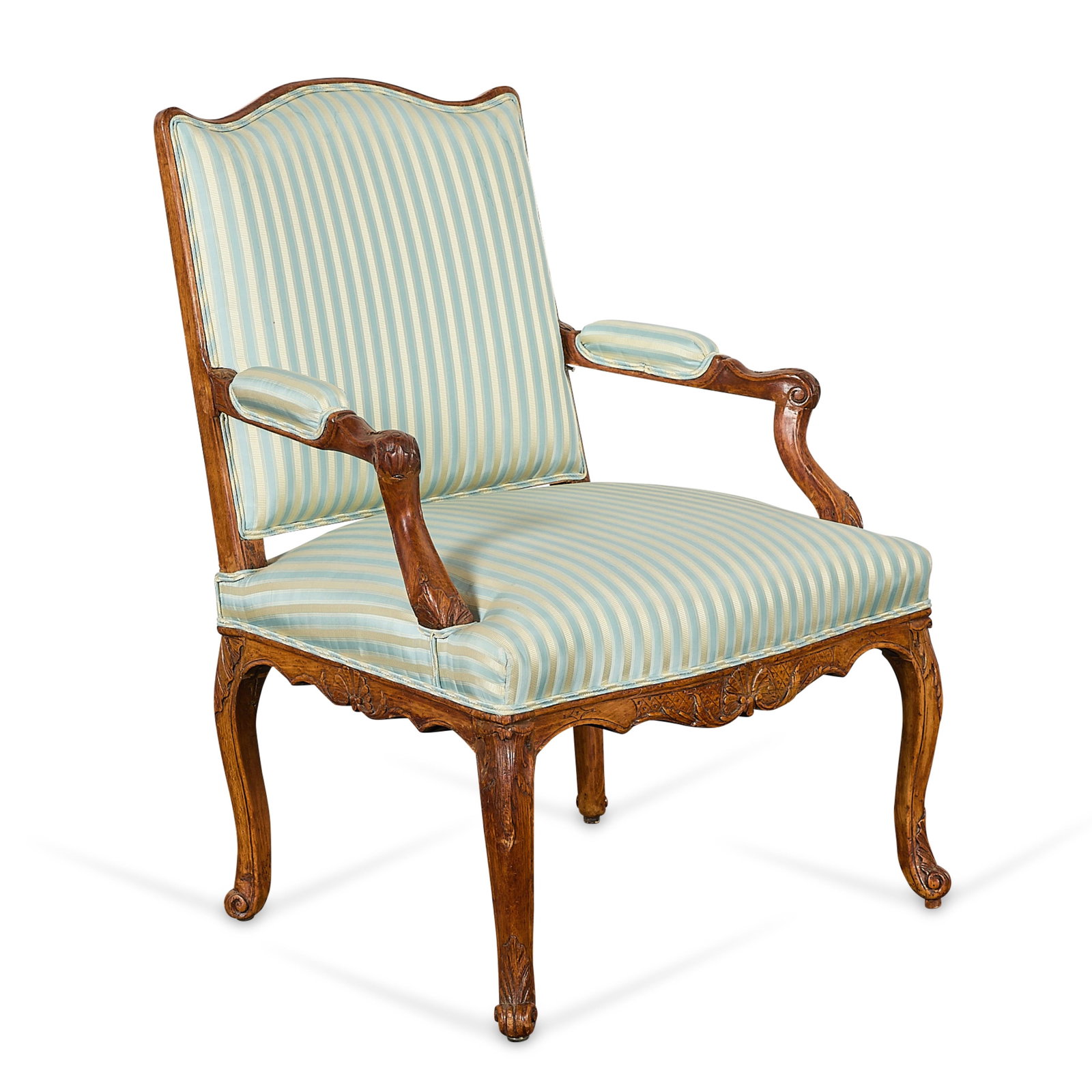 French Regence Beechwood Fauteuil Armchair: French Regence beechwood armchair or fauteuil, 18th century. With a shaped rectangular back, striped upholstered seat, padded armrests, and cabriole legs terminating in scroll feet. Provenance: Old Ve
