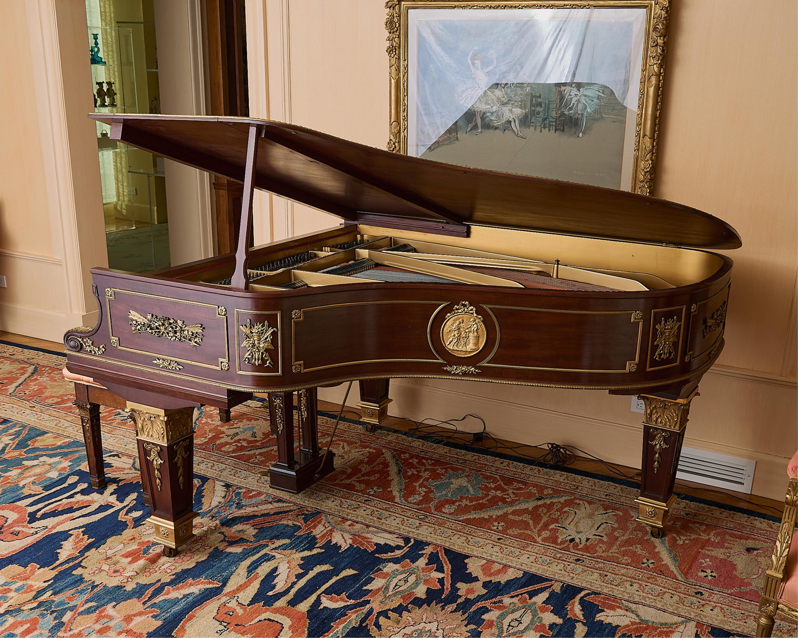 Steinway & Sons Model A Baby Grand Piano 1905: Steinway & Sons, New York. Model A mahogany baby grand piano, 1905. Mounted with gilt-bronze neoclassical forms and roundels applied to the body, resting on square tapering legs with acanthus-cast orm