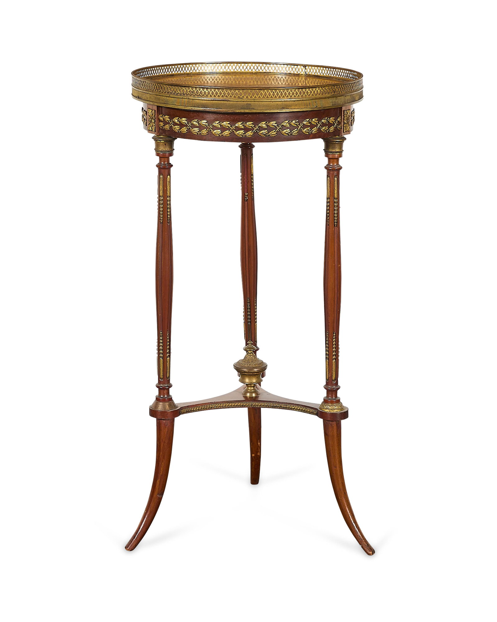 Louis XVI Mahogany & Marble Gueridon Table: Louis XVI mahogany guerdion, or pedestal side table, 19th century. Featuring a rounded marble table top surface, a reticulated brass gallery garland, a frieze adorned with gilt metal foliate mounts, a