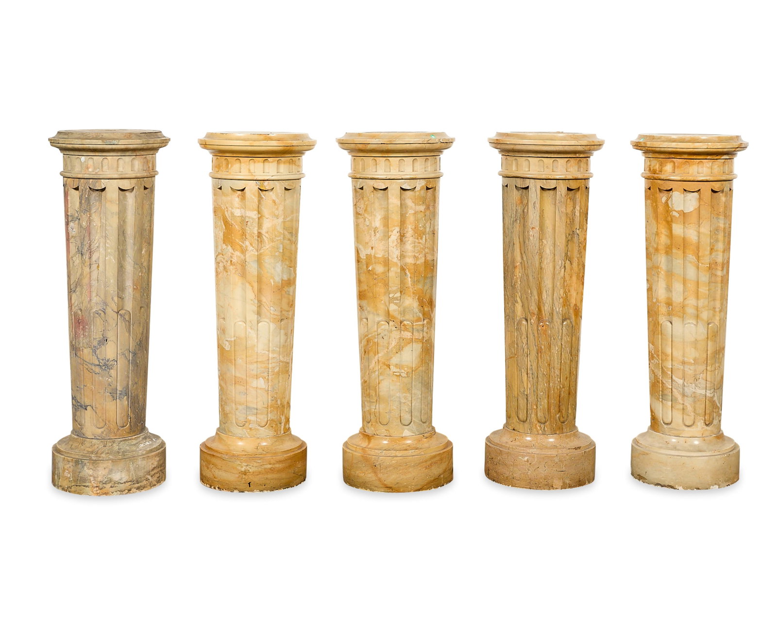 5 Neoclassical Carved Yellow Marble Pedestals: Set of five Neoclassical variegated yellow marble pedestals, 19th-20th century. Possibly carved from Sienna marble. Each with circular top above a fluted rim and reeded, tapering shaft. Surmounted ato