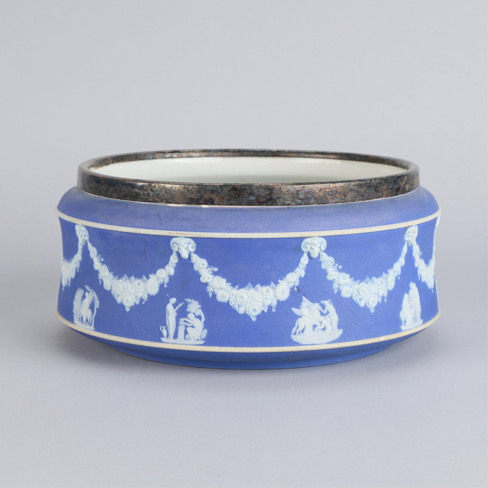 Wedgwood Pottery Jasperware Bowl w/ Silverplate: Wedgwood Pottery, England. Ceramic blue and white "Jasperware" fruit bowl or jardiniere vessel, late 19th-20th century. Depicting applied classical figures and floral garlands along the exterior. With