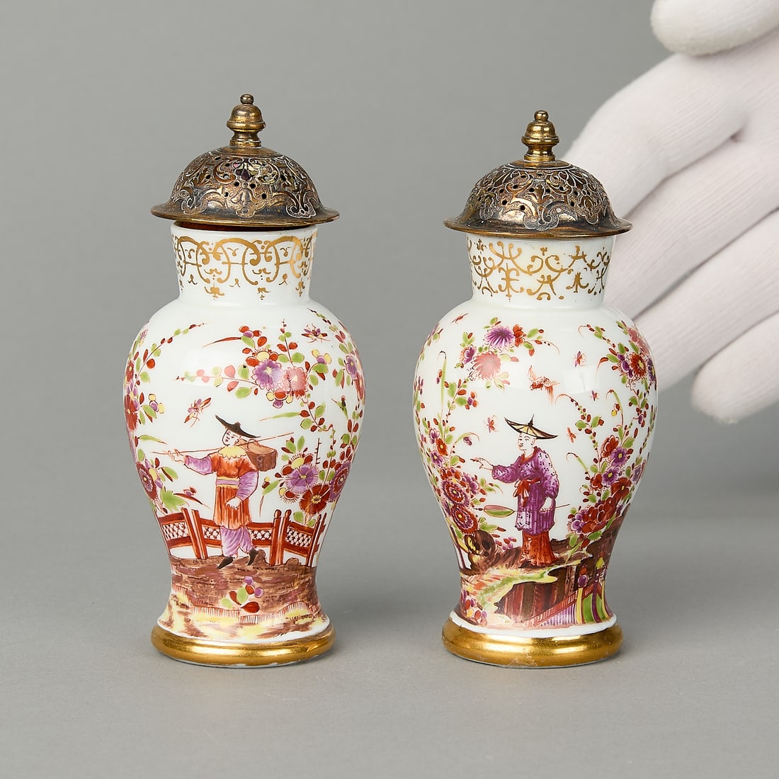 Pr Meissen Mini Baluster Vases ca. 1730: Meissen, Germany. Pair of miniature porcelain baluster vases, ca. 1730. Painted by I.E. Stadler with Chinoiserie figures standing on rockwork in fenced gardens with flowering Indianische Blumen. Blue 