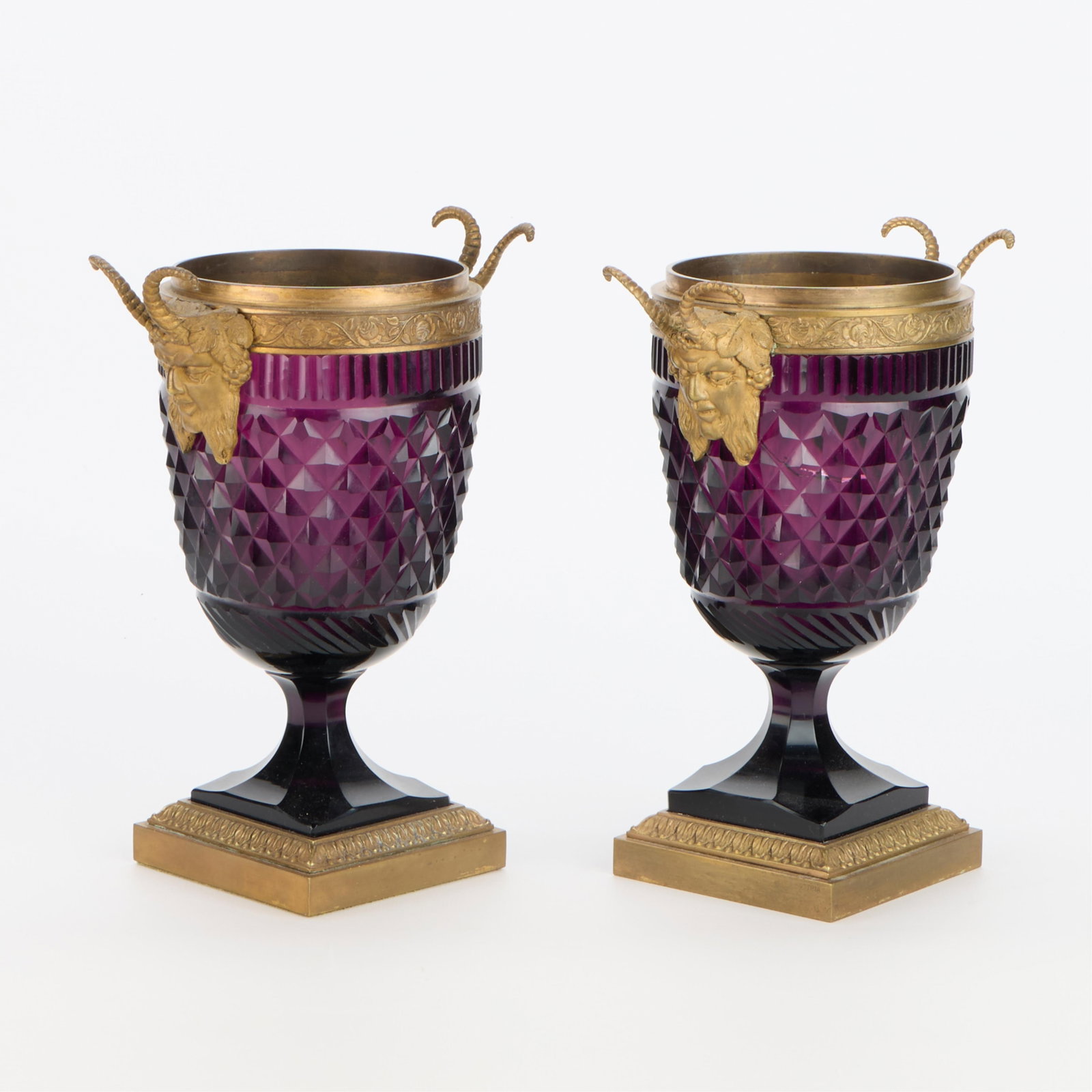 Pair 19th c. Continental Amethyst Cut-Glass Urns: Pair of Continental or Austrian gilt bronze ormolu-mounted amethyst cut-glass urns, late 19th century. Each of deep plum-hued purple amethyst glass, cut in a diamond lattice pattern and mounted at the