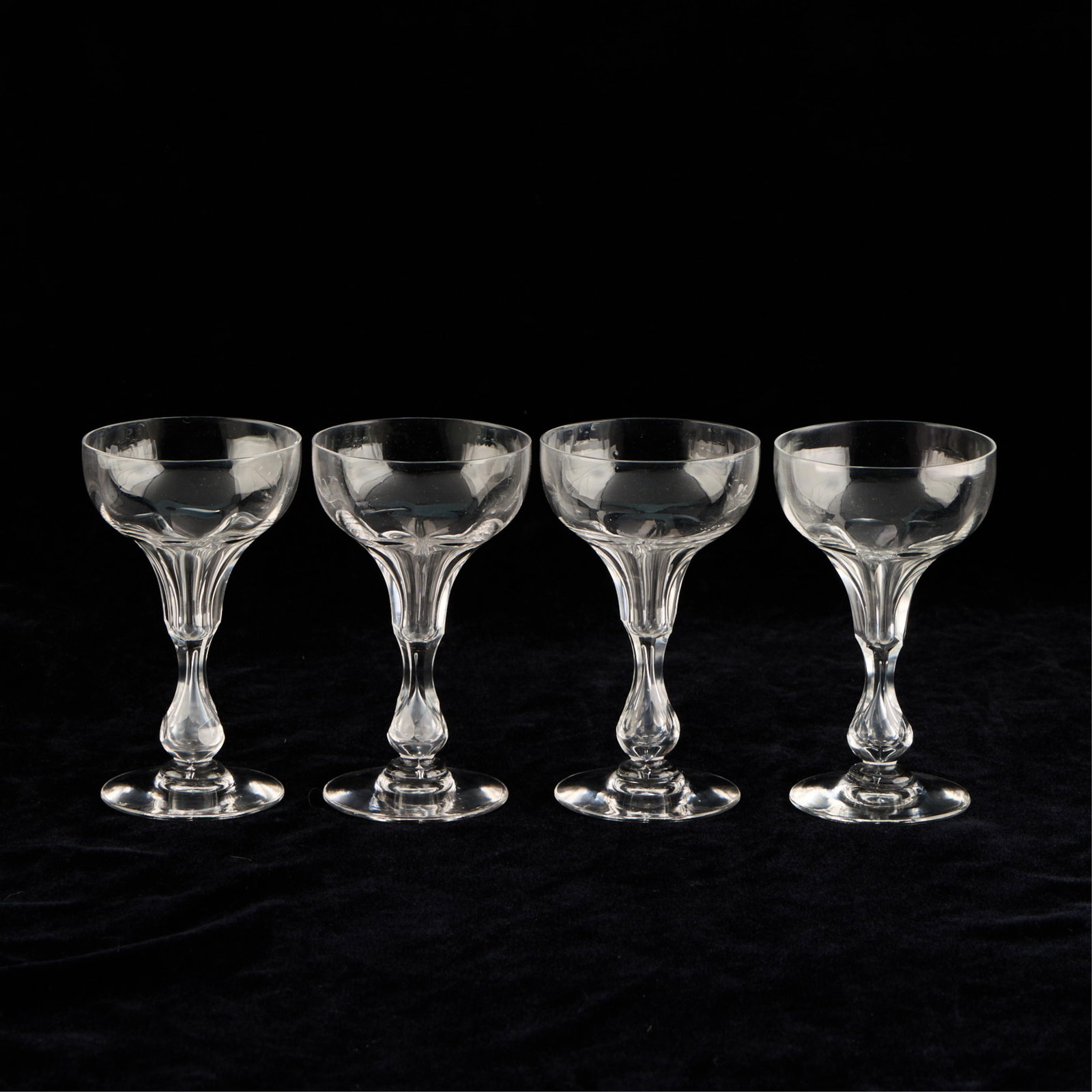 4 Art Deco Hollow Stem Champagne Coupe Glasses: Set of four Art Deco champagne coupes or cocktail glasses with hollow, bulbous stems, early 20th century. Provenance: The Distinguished Collection of Leo & Doris Hodroff. (Each) height: 5 1/4 in x dia