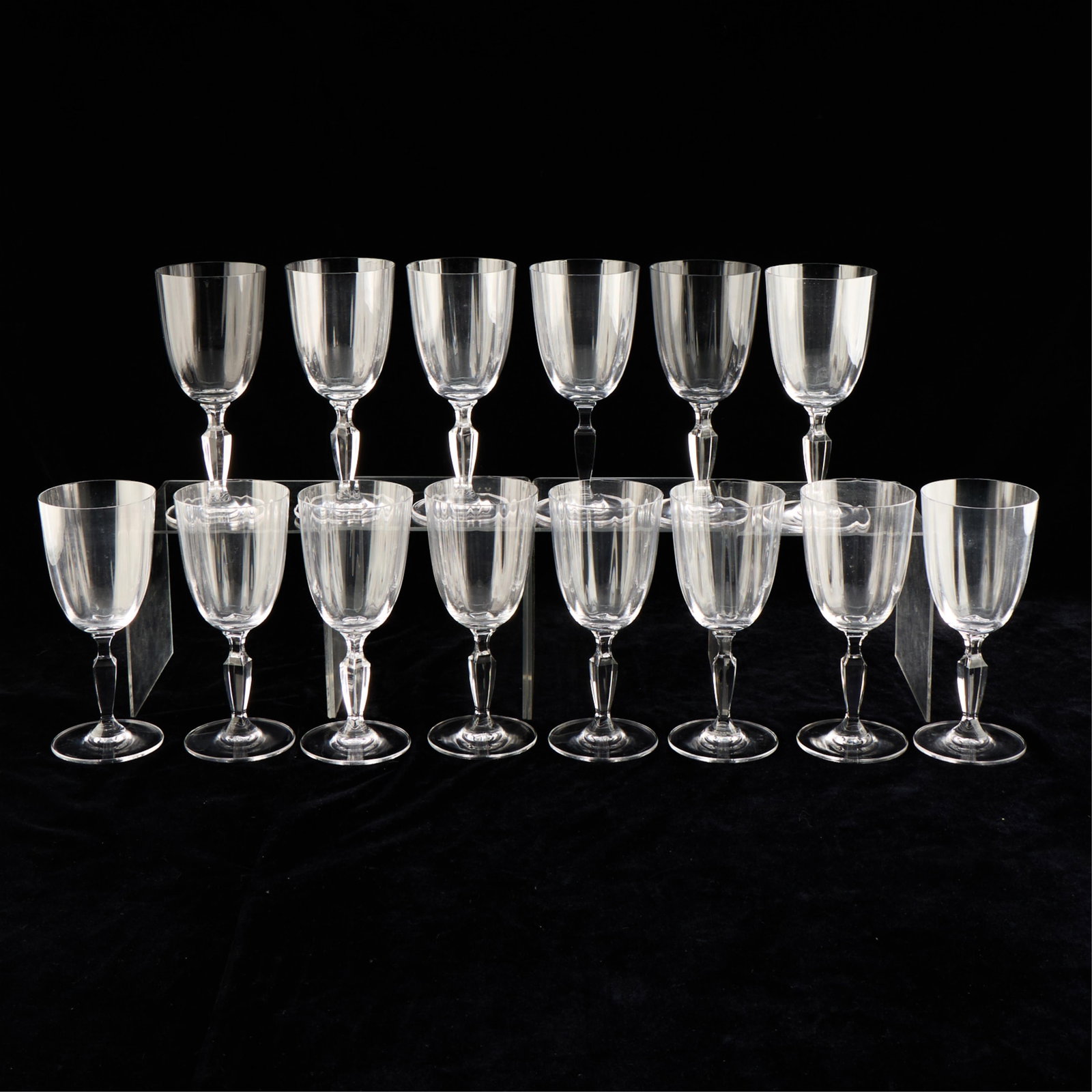 14 Villeroy & Boch Crystal Glass "Malindi" Goblets: Villeroy & Boch, Germany. Set of 14 "Malindi" pattern crystal water goblet glasses, 20th century. With faceted stems. Each with etched mark along the foot. Provenance: The Distinguished Collection of 