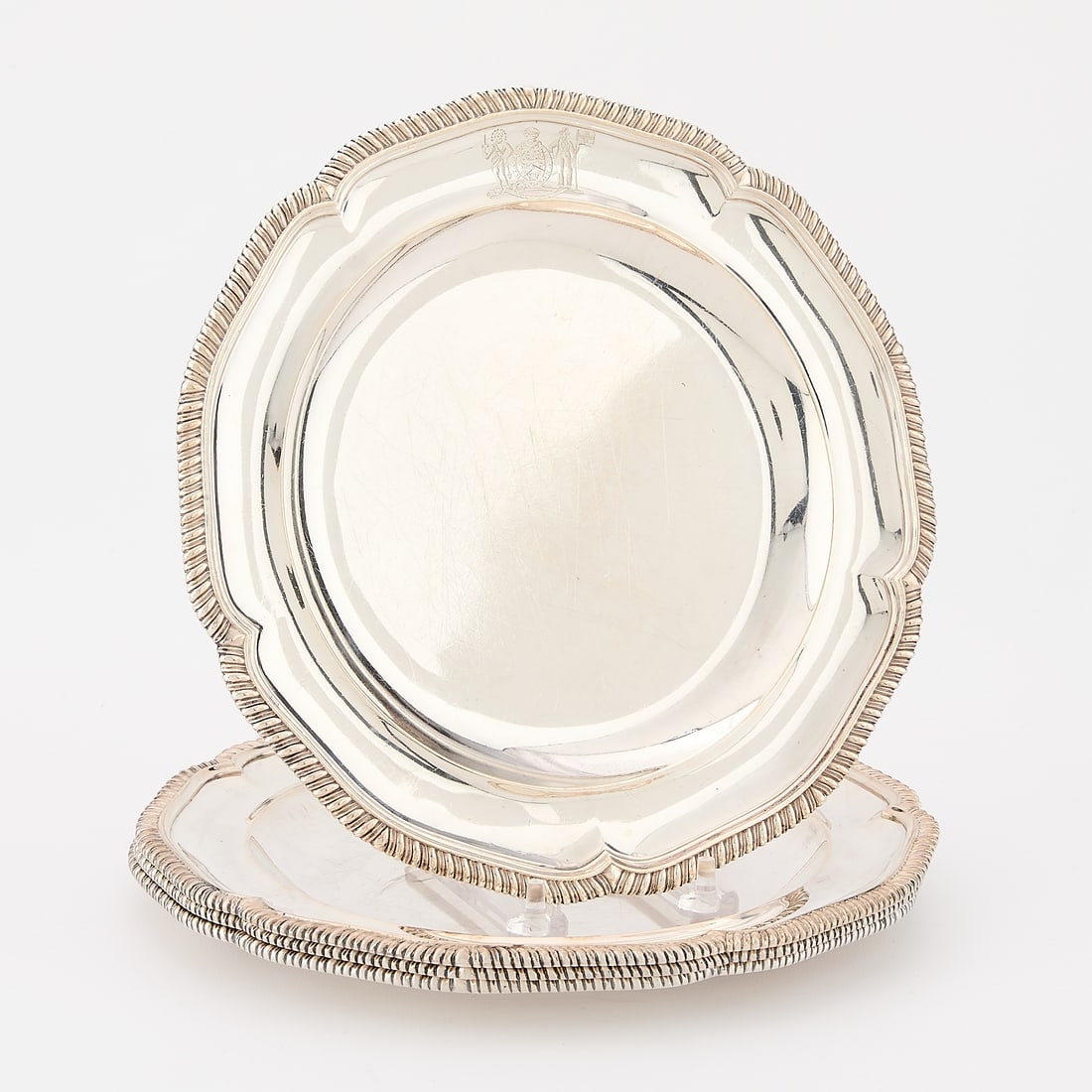 Set 4 English Sterling Silver Plates 83.15 ozt: Set of four English sterling silver plates with decorative border and engraved crest along the rim, early 19th century. Unidentified crest. Each initialed "WS," possibly for William Southy. Further ma