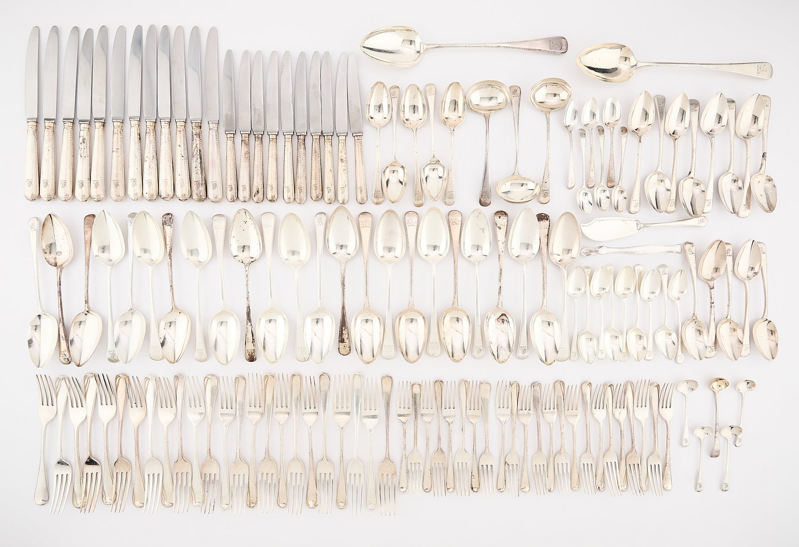 138 Pc Set George III Sterling Flatware 168 ozt: Large set of 138 pieces of English sterling silverware with bright cut edge detail and lion crest. Date letters indicating a range of 1778 to 1828. All marked for sterling variously and mostly London.