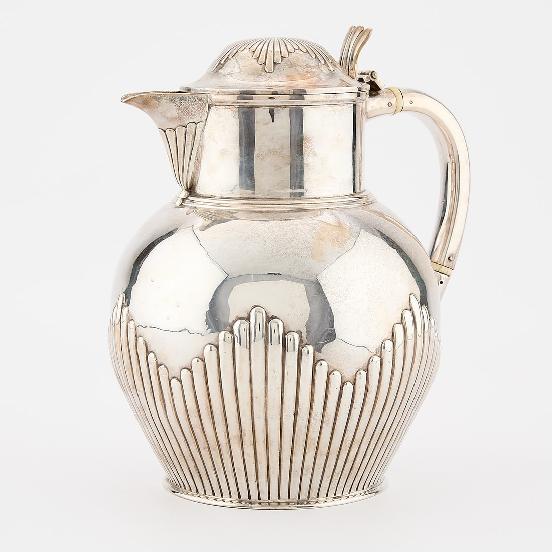 Elkington Victorian Sterling Pitcher 34.19 ozt: Elkington & Co. Silversmiths, England. Victorian sterling silver pitcher of fluted design with hinged lid, 1880. With maker's initials, stamped lion passant, crowned leopard London assay mark, Queen V