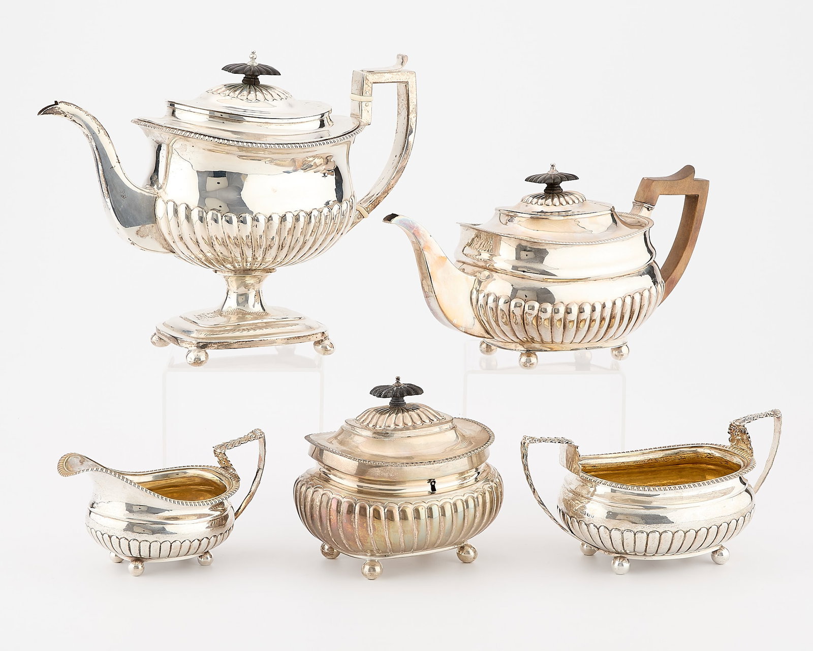 5 Pc English Georgian Sterling Tea Set 83.74 ozt: Set of five English Georgian era sterling silver tea vessels, ca. early 19th century. Including: one teapot, one teapot with pedestal base, one creamer, one double-handled waste bowl, and one lidded t