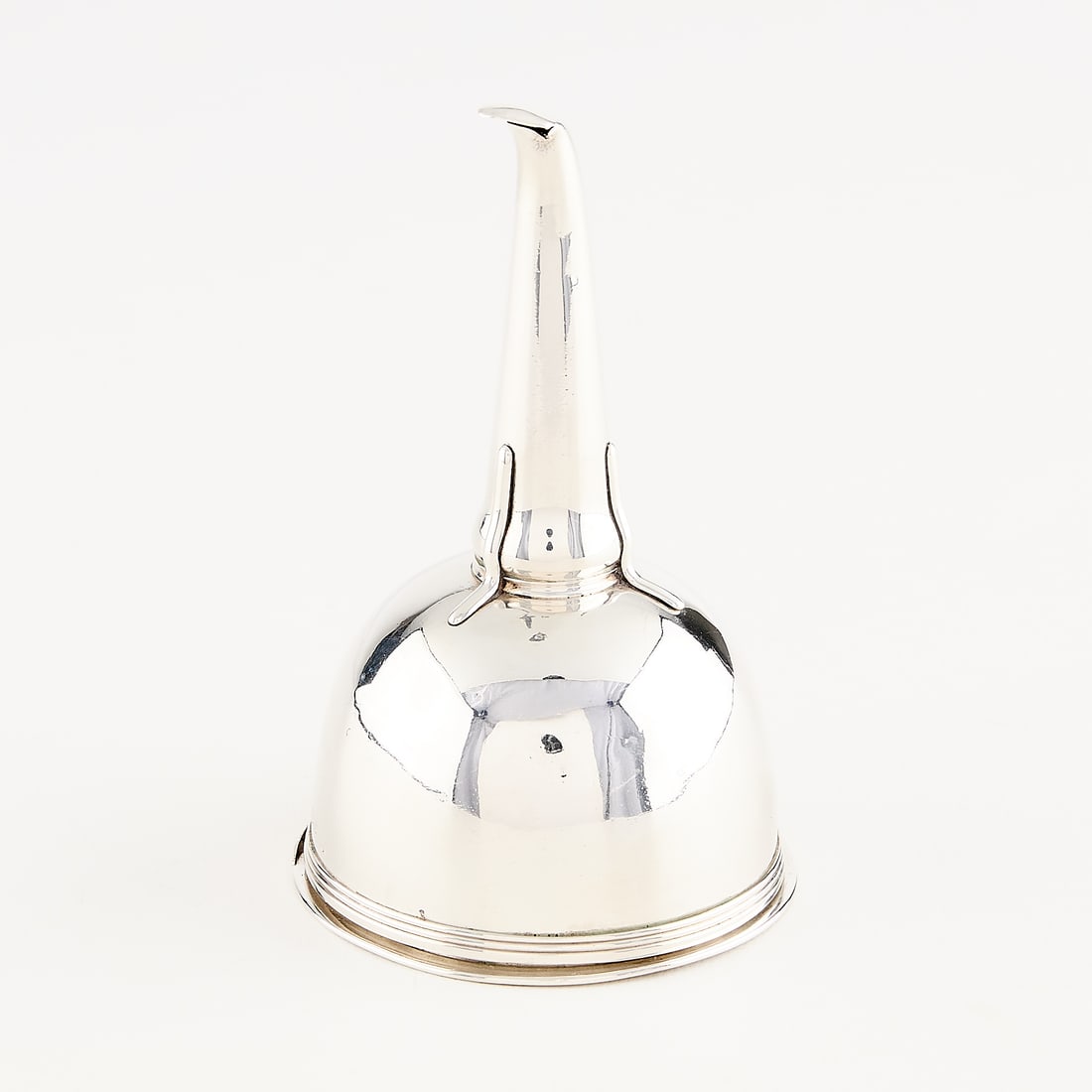 English Sterling Wine Funnel 4.38 ozt: English sterling silver wine funnel comprised of two parts, the inner basin with pierced floral design, the exterior with reeded borders. Monogramed G. Marked for sterling, London, 1808, King George I