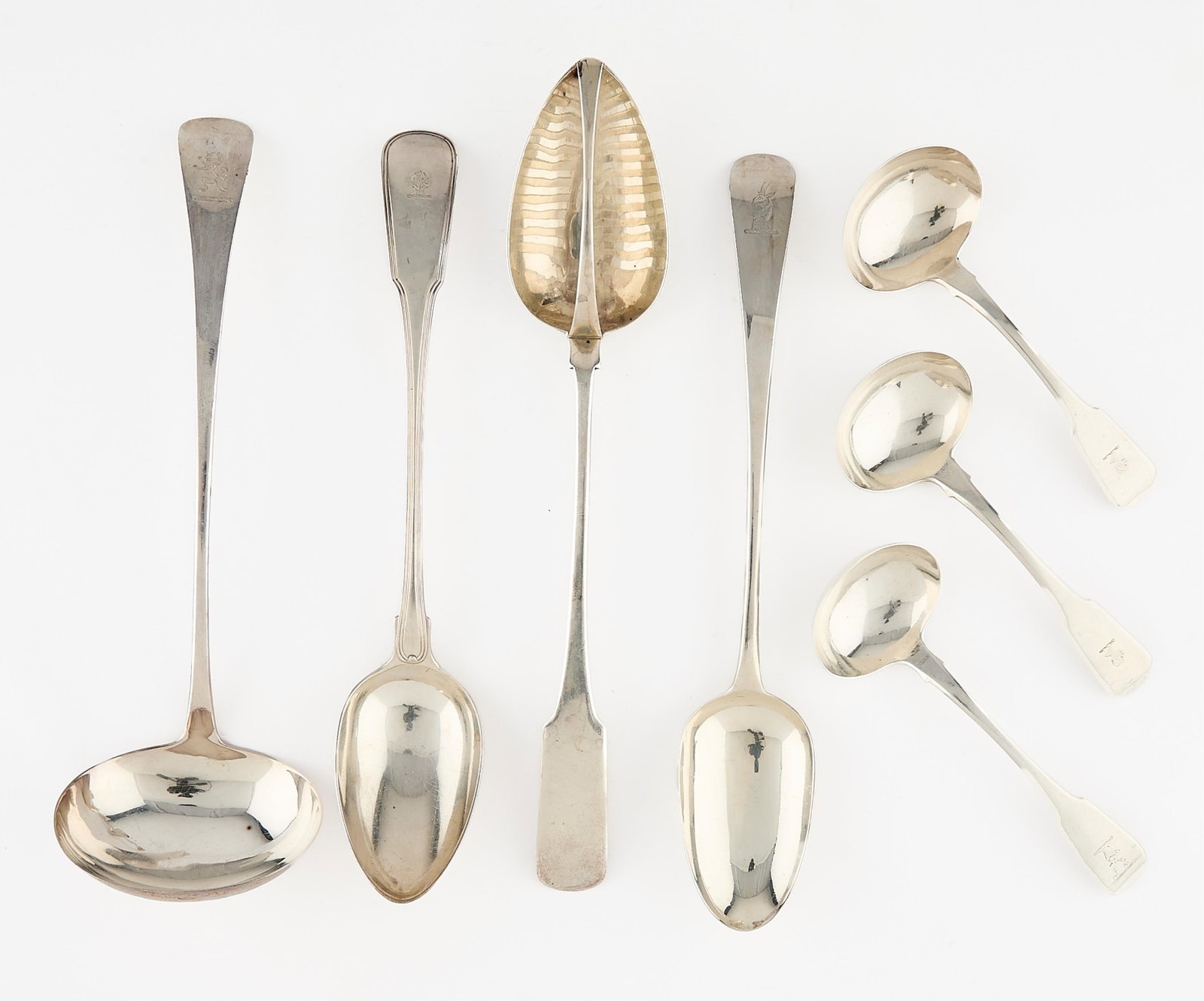 7 English Sterling Spoons & Ladles - 24.21 ozt: Group of seven English sterling silver spoons, 19th century. Including: One large sterling silver ladle, 1800. With lion passant for sterling, King George III in profile, London assay mark, and date l