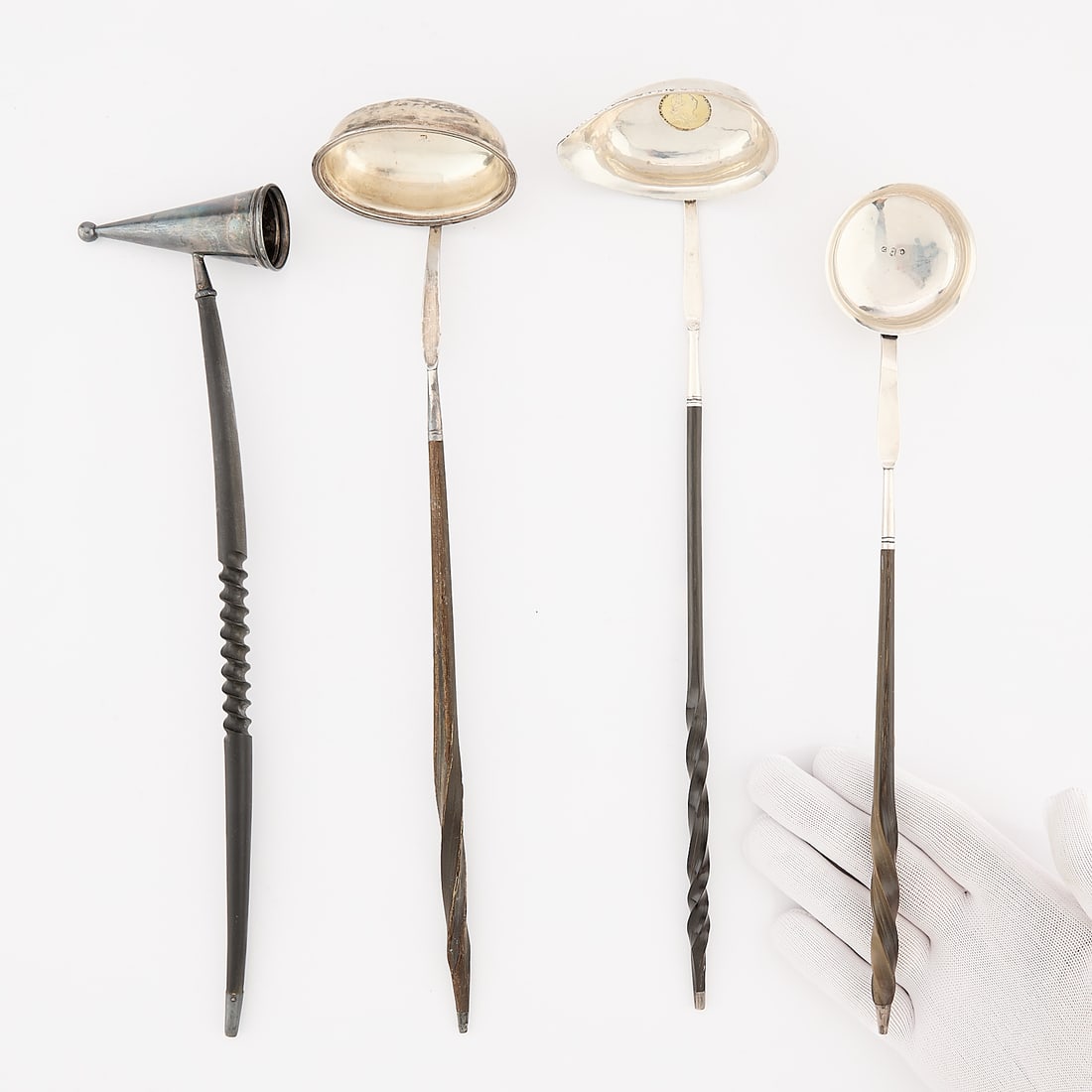 4 English Wood Mounted Silver Utensils 189.2 g: Group of four wood mounted silver utensils. Including: One English sterling silver ladle with wood stem, 1806. With stamped lion passant for sterling, King George III in profile, crowned leopard Londo