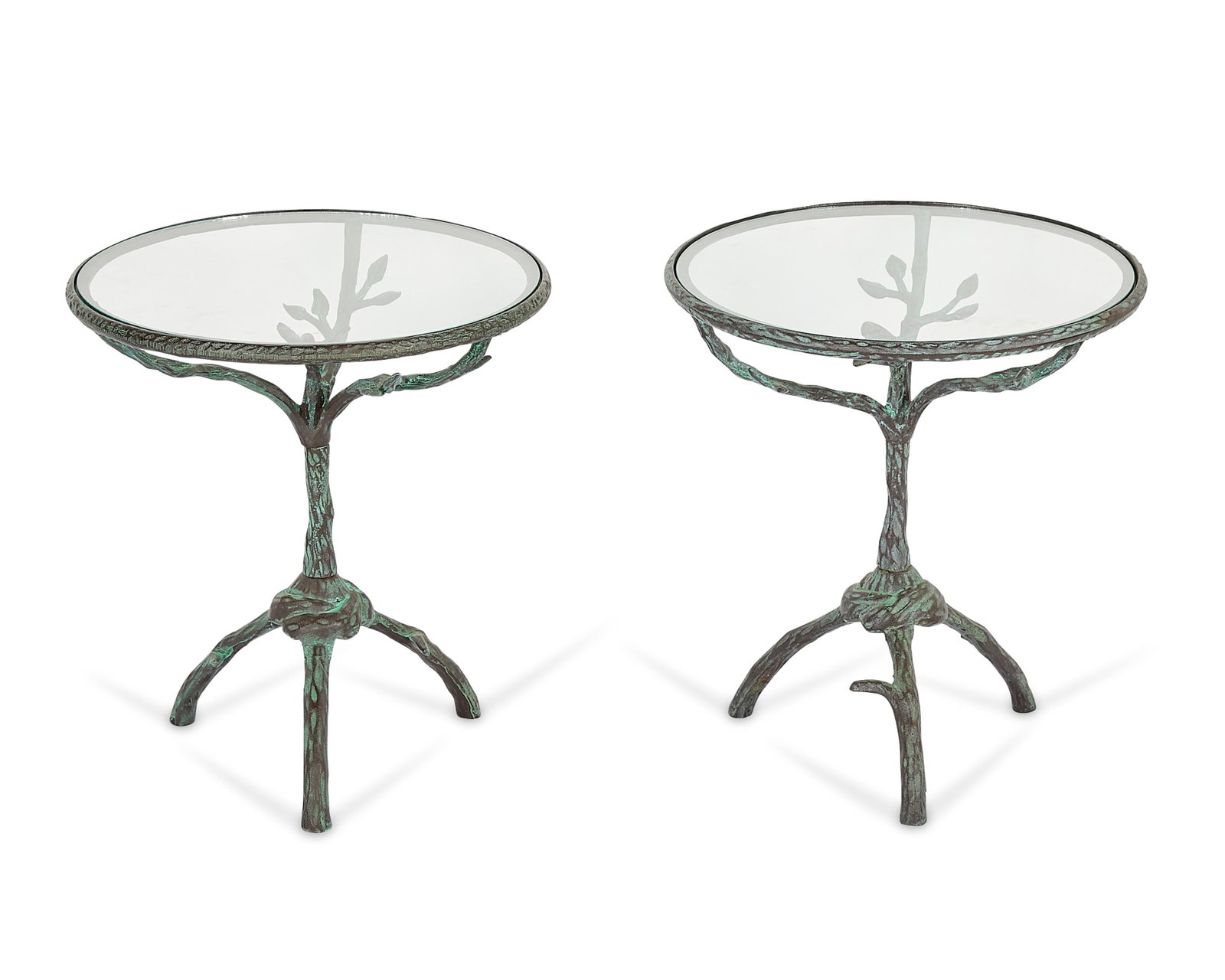 Pr Style of Diego Giacometti Bronze Side Tables: Style of Diego Giacometti (Swiss, 1902-1985). Pair of patinated bronze side tables, 20th century. Each featuring a rounded glass table top surface supported by a sculptural tripod bronze base in the f