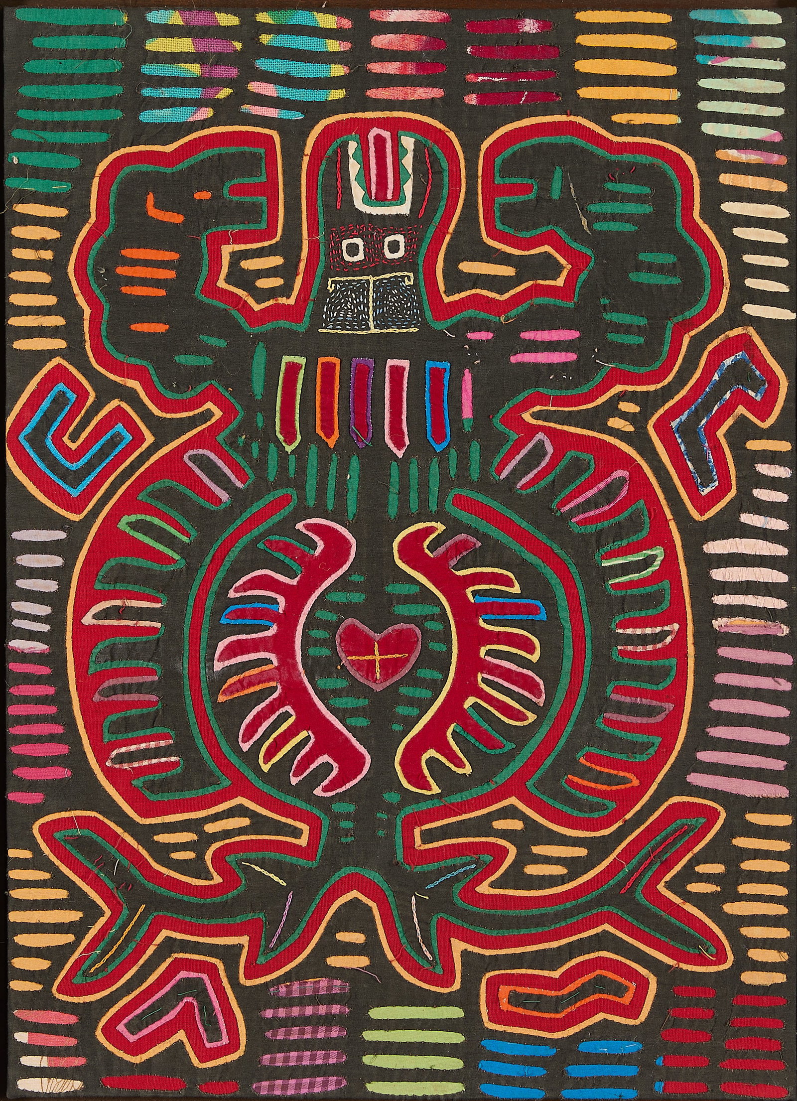 Central American Embroidered Mola Textile: Panamanian or Colombian Guna embroidered mola textile, 20th century. Depicting an anthropomorphic mythical being resembling a turtle executed in vibrant layered and stitched fabrics. Provenance: The D