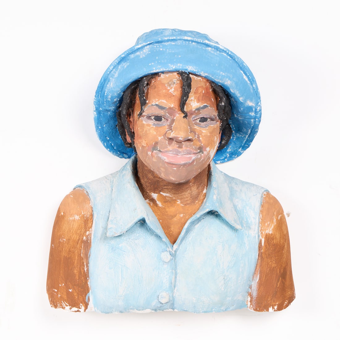 John Ahearn "Aatika" Acrylic on Plaster 1998: John Ahearn (America, b. 1951). Acrylic on plaster wall hanging sculpture titled "Aatika," 1998. Featuring a young girl wearing a vibrant blue hat and a light blue collared shirt. Featuring a high