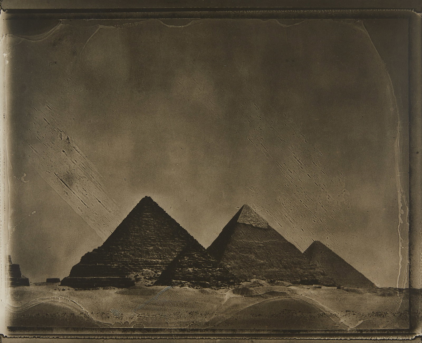 Sarah Moon "Le Caire" GSP Photograph 1994: Sarah Moon (French, b. 1941). Gelatin silver print photograph titled "Le Caire," 1994. Depicting the Pyramids of Giza in Cairo, Egypt. Signed, titled, and editioned 6/20 along the verso. Provenance: W