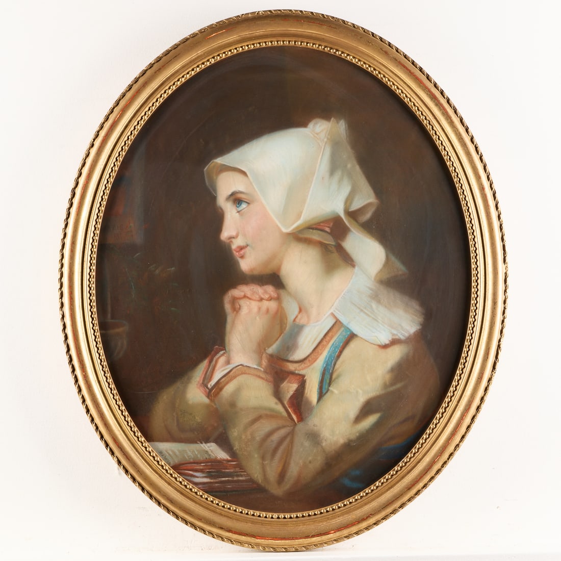 Victorian Portrait of a Woman Pastel Drawing: Victorian pastel on paper drawing depicting the portrait of a young woman wearing a white bonnet. Signed and dated indistinctly along the lower left; possibly dated 1861. With a Durand-Ruel inkstamp a