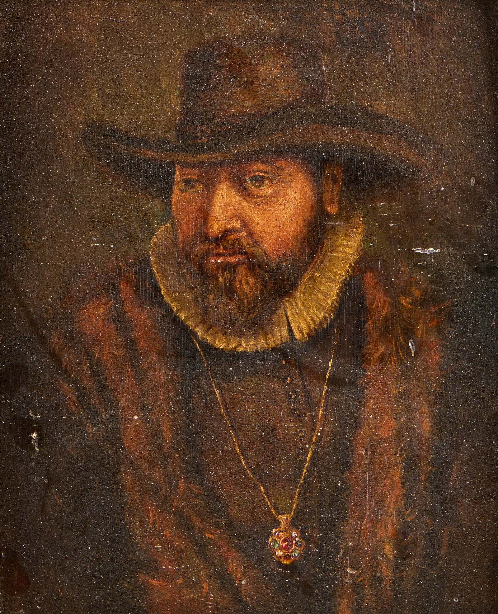 Portrait of a Bearded Man Oil Painting: Oil on board painting depicting the portrait of a bearded man wearing a dark hat and bejeweled necklace. With three toned paper labels along the verso, including one John Schullian Frames label, one l