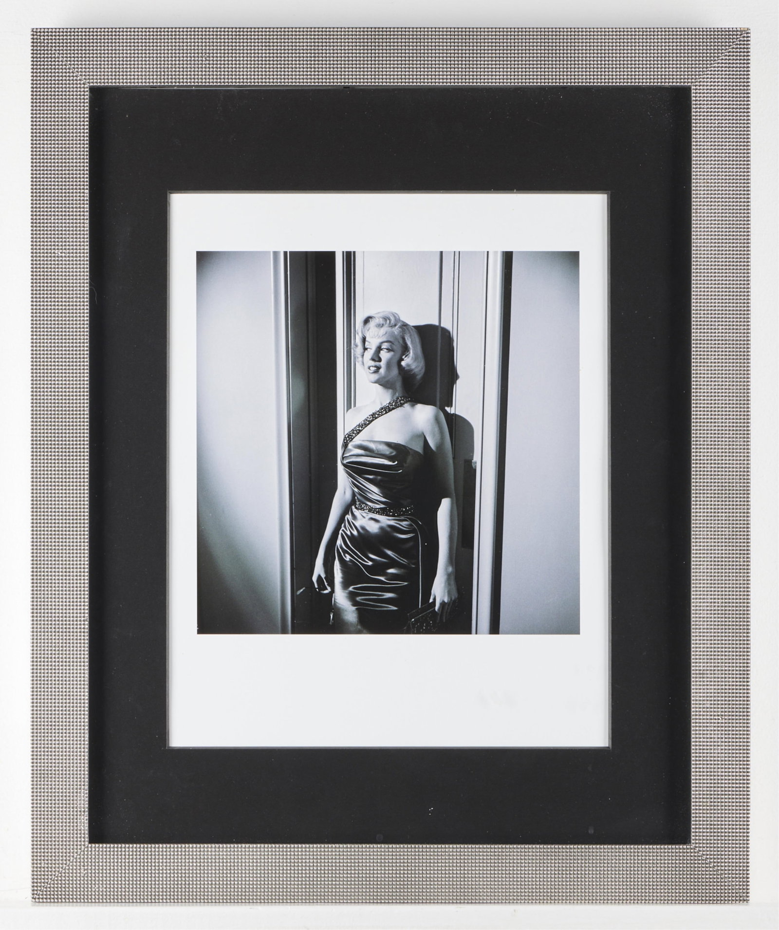 Marilyn Monroe "Marry a Millionaire" Lithograph: Lithograph depicting actress Marilyn Monroe against a wall, from the set of "How to Marry a Millionaire," original photograph taken ca. 1953, printed later. Blindstamped "Frank Worth Estate" along the