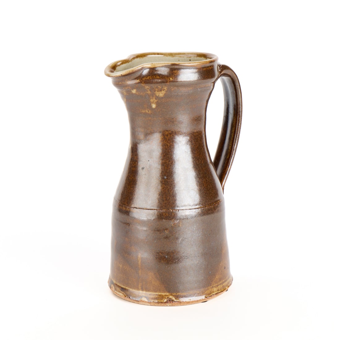 Warren MacKenzie Pottery Pitcher - Double Stamped: Warren MacKenzie (American, 1924-2018). Studio pottery ceramic pitcher. Stoneware with a tenmoku glaze. Double-stamped along the base of the handle. Warren MacKenzie was a renowned Minnesota studio