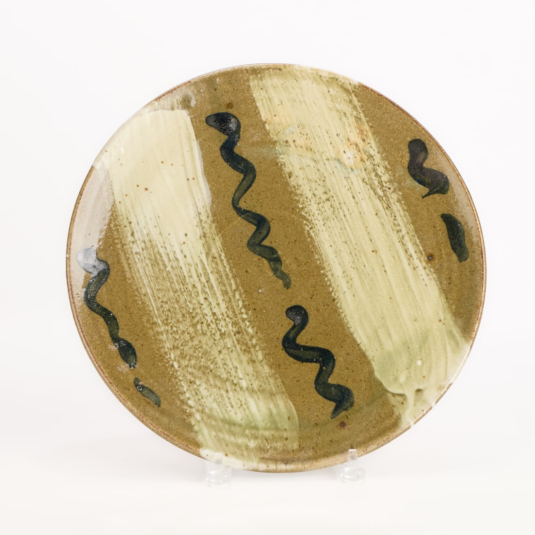 Lrg Warren MacKenzie Studio Pottery Platter: Warren MacKenzie (American, 1924-2018). Studio pottery ceramic platter or charger. Stoneware with green hakame glaze and MacKenzie's iconic finger swipe marks. The platter is not marked; however, the
