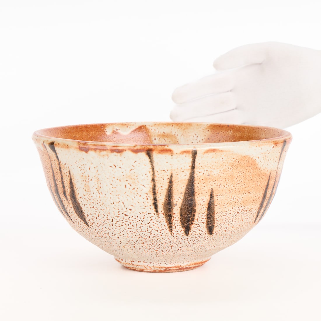 Lrg Warren MacKenzie Studio Pottery Bowl - Marked: Warren MacKenzie (American, 1924-2018). Large studio pottery ceramic serving bowl. Stoneware with shino glaze, featuring slip trails or MacKenzie's iconic finger swipe marks. Stamped along the