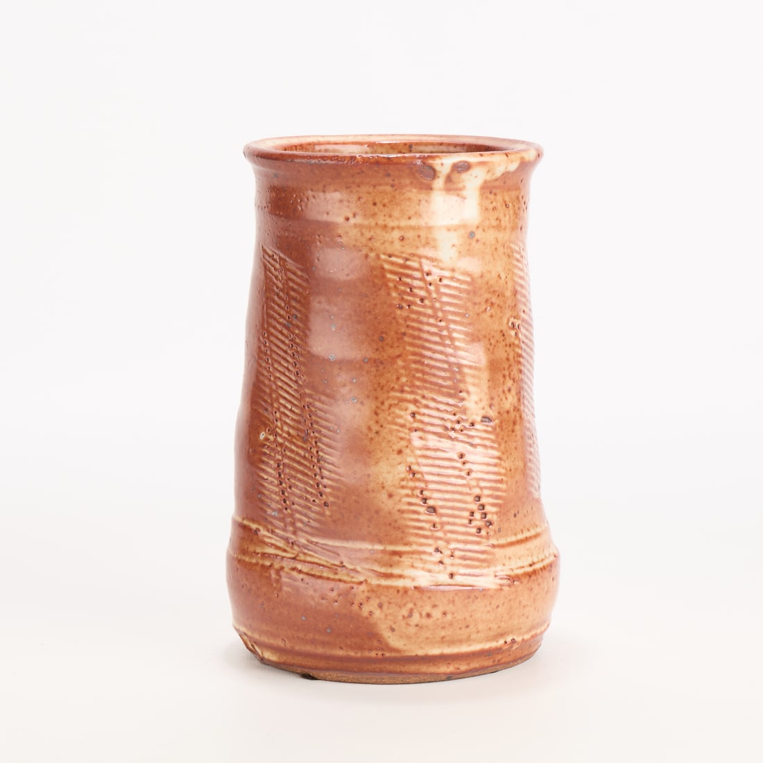 Warren MacKenzie Red Studio Pottery Vase - Marked: Warren MacKenzie (American, 1924-2018). Studio pottery ceramic vase. Stoneware with a shino glaze with impressed, textured paddle motifs. Stamped along the footrim. Warren MacKenzie was a renowned Min