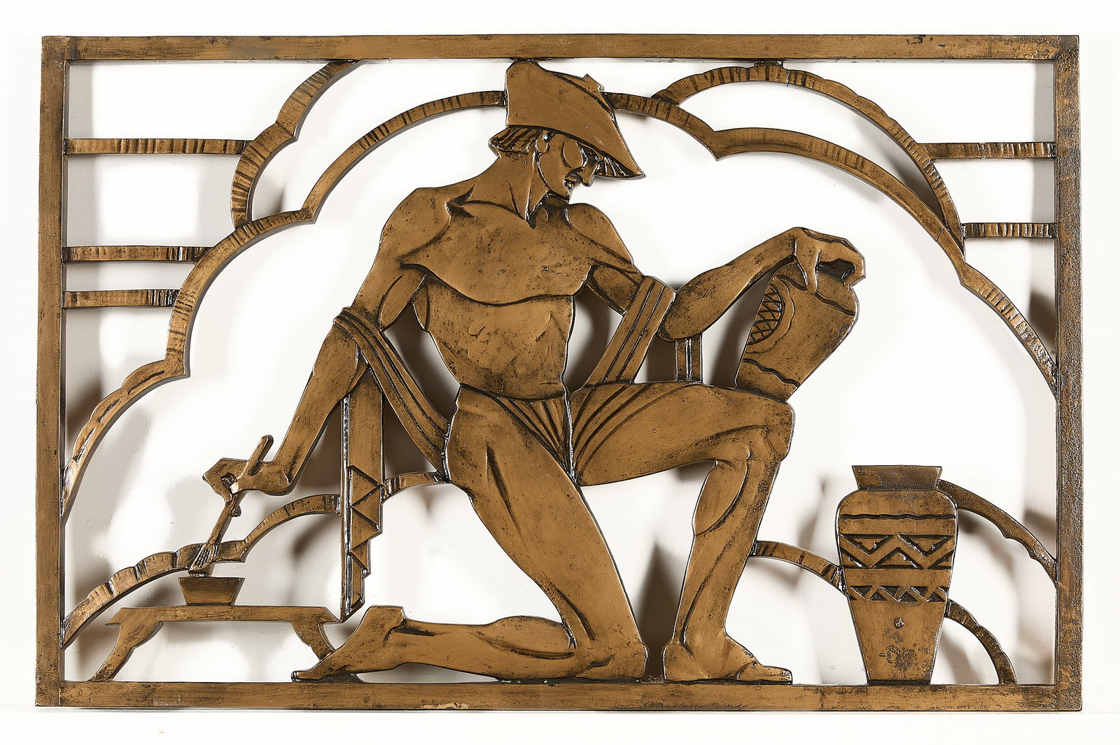 Art Deco Cast Bronze Art Sculptural Figurative Panel: Art Deco cast bronze sculptural panel depicting a kneeling figure in the process of delicately painting a vase. Height: 25 in x width: 38 1/2 in x depth: 1 in.