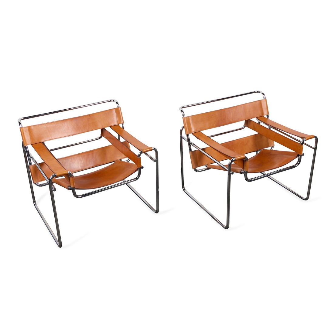 Pr Marcel Breuer MCM "Wassily" B3 Arm Chairs: Marcel Breuer (Hungarian, 1902-1981). Pair of mid-century modern "Wassily" model "B3" club, lounge, or arm chairs, ca. 1960s. Composed of tubular chromed steel frames with brown belting leather uphols