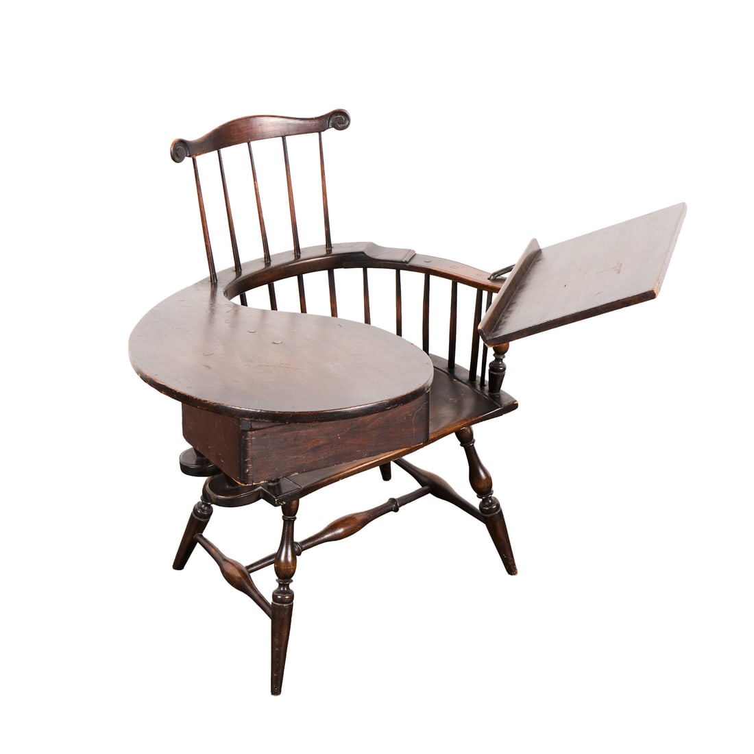 19th c. Windsor Spindle-Back Writing Arm Chair: Antique Windsor transitional "continuous arm" right-handed writing desk, 19th century. Composed of carved walnut wood. Featuring an integrated writing paddle with drawer, a contoured wooden plank seat