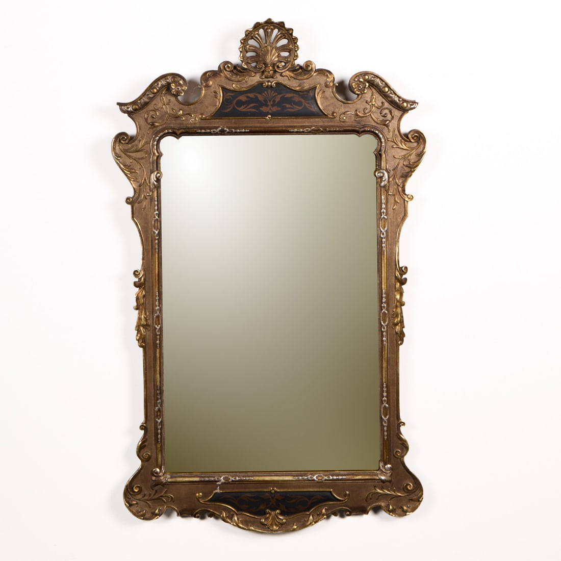 Italian Regency Style Carved Giltwood Mirror: Italian Regency style carved giltwood mirror, 19th century. Featuring an elaborately carved upper cartouche with a shell-shaped crest and scrolling acanthus leaves along the perimeter. With an illegib