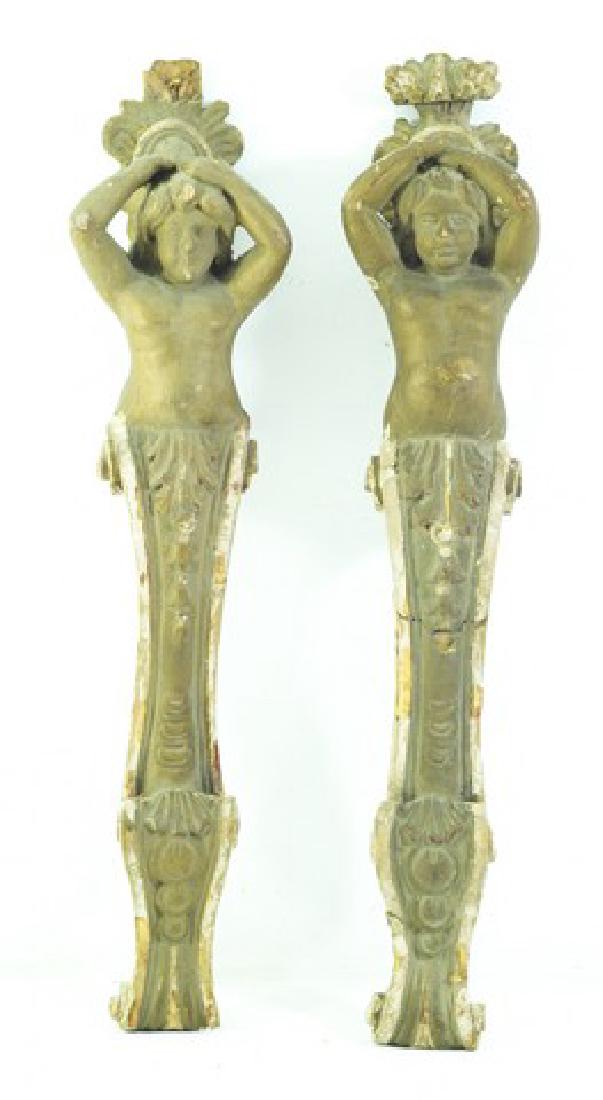 Pair of antique wall ornaments: Pair of antique wall ornaments, gilded wood and plaster, children, defects, length: 43 cm.