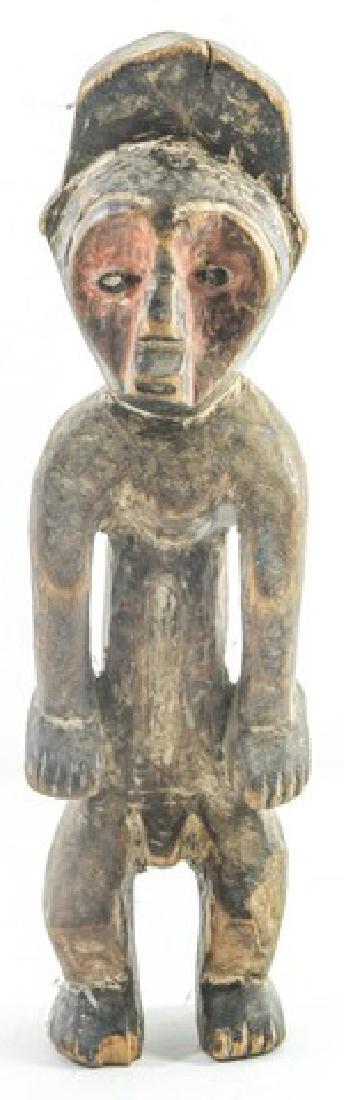 Old African tribal wooden figure, man leaning foreward: Old African tribal wooden figure, man leaning foreward on his hands, Lega Iginga, Congo, his face is hand-painted, crack in top part, paint is worn, small piece missing from foot, height: 30 cm.