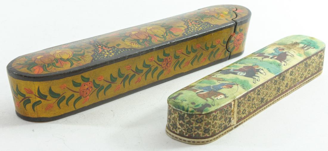 Lot of 2 Persian Klamdan pencil boxes: Lot of 2 Persian klamdan pencil boxes, papier mache, with hand-painted decorations and gildings: one with a Persian war game and the other with flowers, open sideways, a little rounded, length: 20.5-2