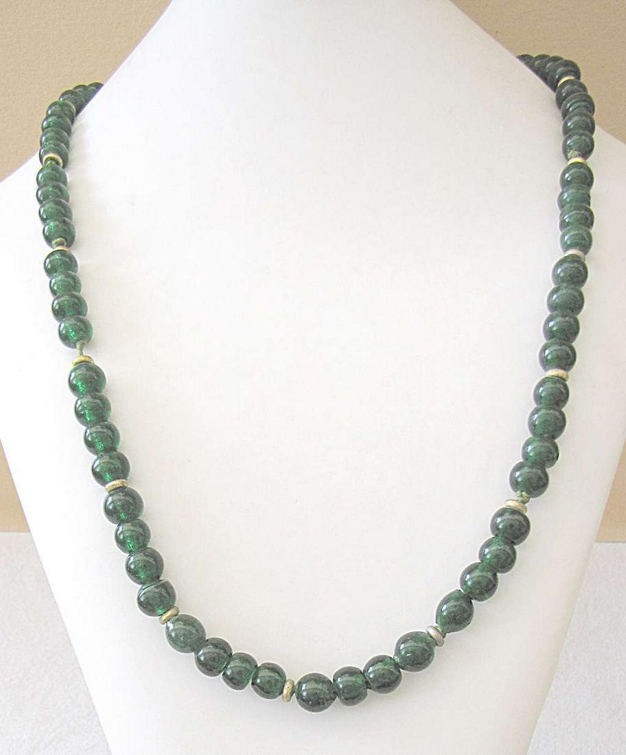 Murano Italy antique dark green glass bead necklace, 74: Murano Italy antique dark green glass bead necklace, 74 gr., length: 67 cm., diameter of bead: 1cm.