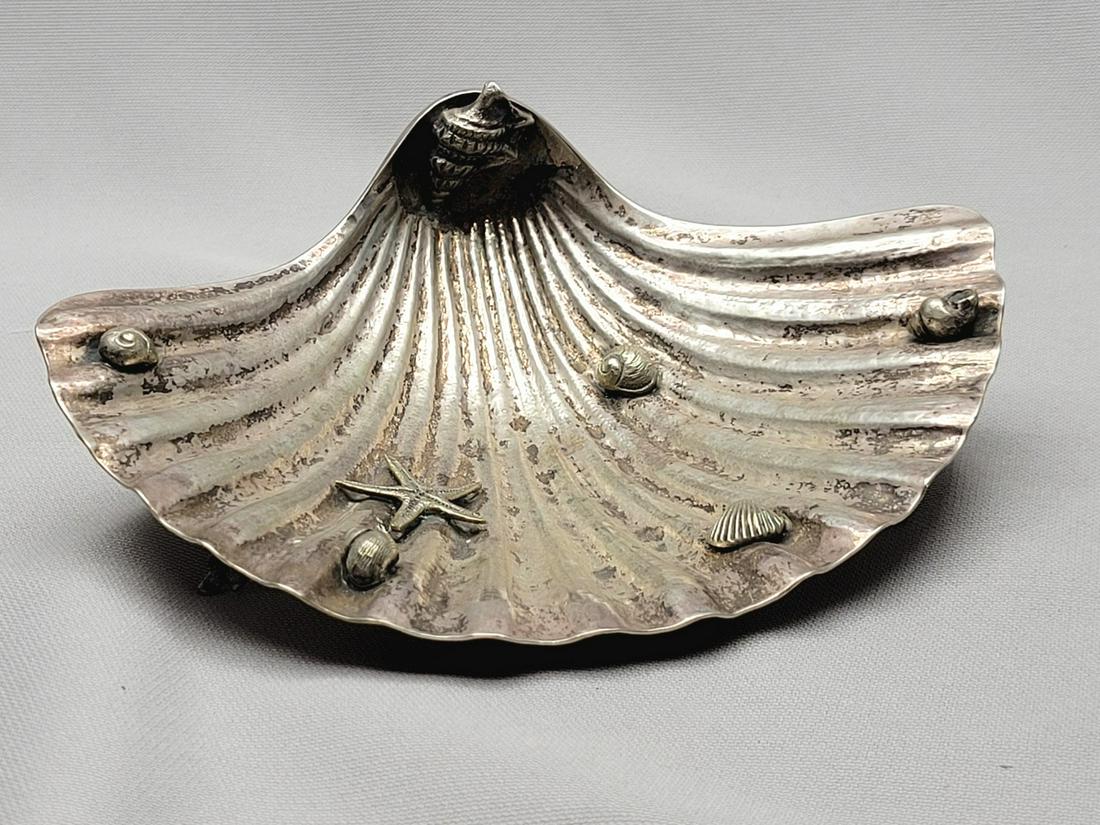 Small Italian Silver Seashell-Shaped Saucer After Buccellati: Small Italian Silver Seashell-Shaped Saucer After Buccellati, decorated witth embossments of shells and starfish, carried on 3 stlized legs in the shape of seashell, marked with the '800' Silver Stand