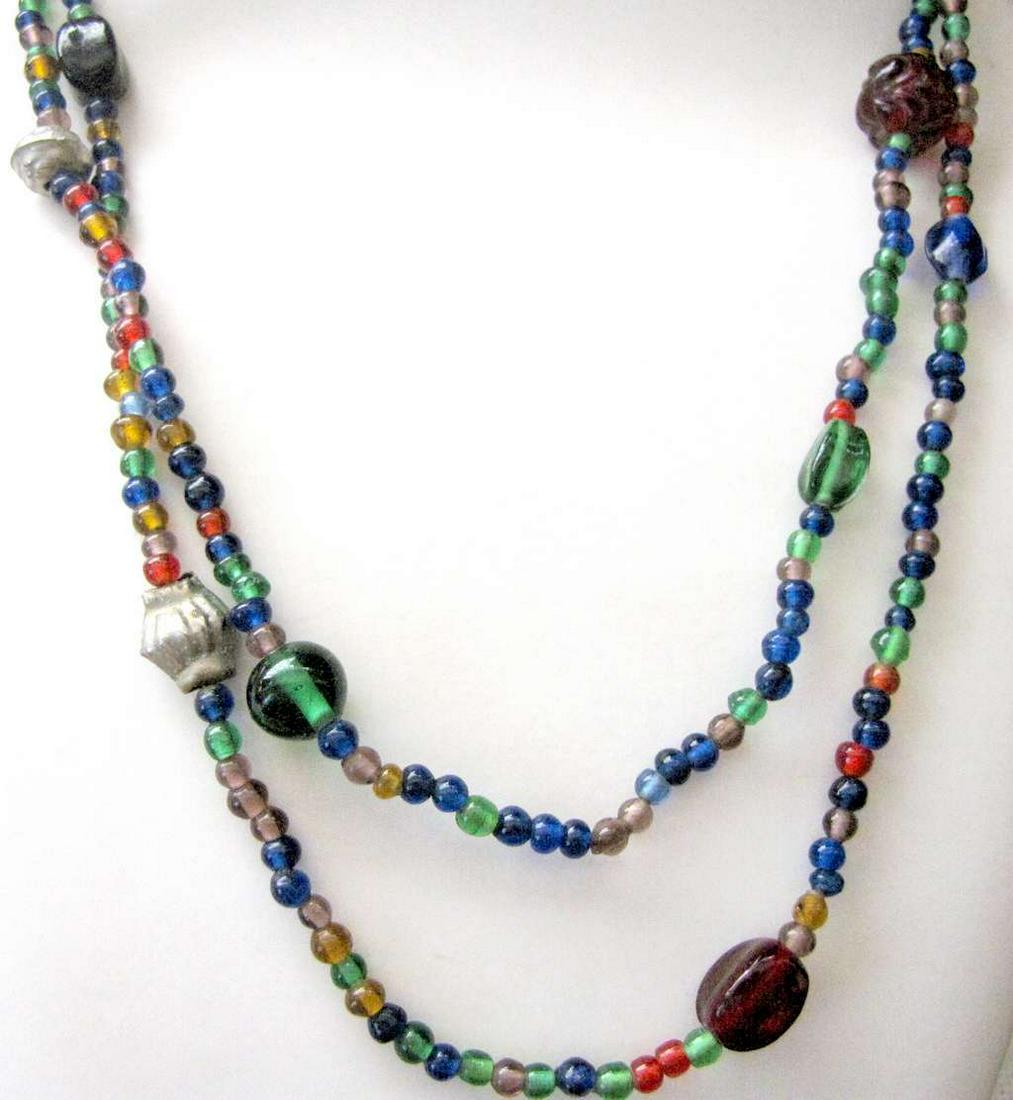 Indo-Persian antique art glass 2 strand bead necklace, 45 gr.: Indo-Persian antique art glass 2 strand bead necklace, 45 gr. Length to neck: 58 cm. (22.8 inches) Diameter of beads from 5 mm till 14 mm. Hand crafted.