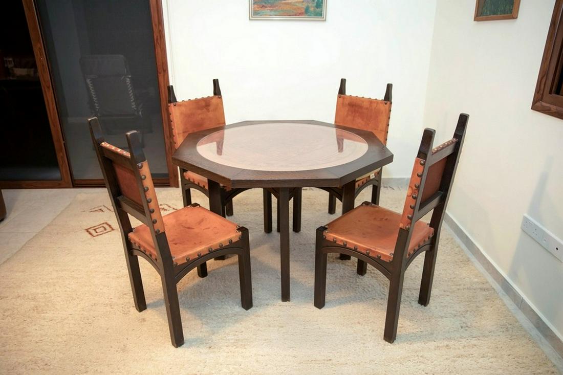 Set of Wood and Peruvian Leather Coffee Table And 4 Matching Chairs: Set of Wood and Peruvian Leather Coffee Table And 4 Matching Chairs, hand decorated with the scene of figures from the mythology of the Inca tribe and the Mayan culture.Made of thick cowhide that is e