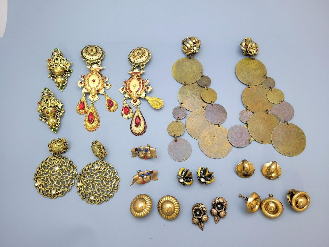 A Assortment Of 11 Pairs Of Impressive Vintage Fashion Gilded Clip-On/Screw-On Earrings: A assortment of 11 pairs of impressive vintage fashion gilded clip-on/screw-on earrings, 1950s-70s, including two pairs of long earrings made by ZOE COSTE, a pair made by DKNY, a pair made in Czechosl