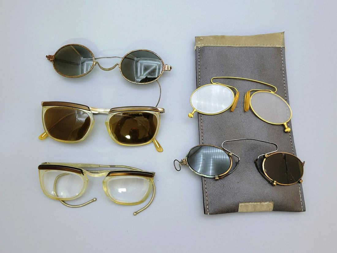 An Assortment Of 5 Pairs Of Vintage Glasses: An assortment of 5 pairs of vintage glasses, circa mid-20th century, made of metal and plastic frames and glass lenses, of which 2 pairs are "pincer" glasses, and 3 regular pairs. In addition, an orig