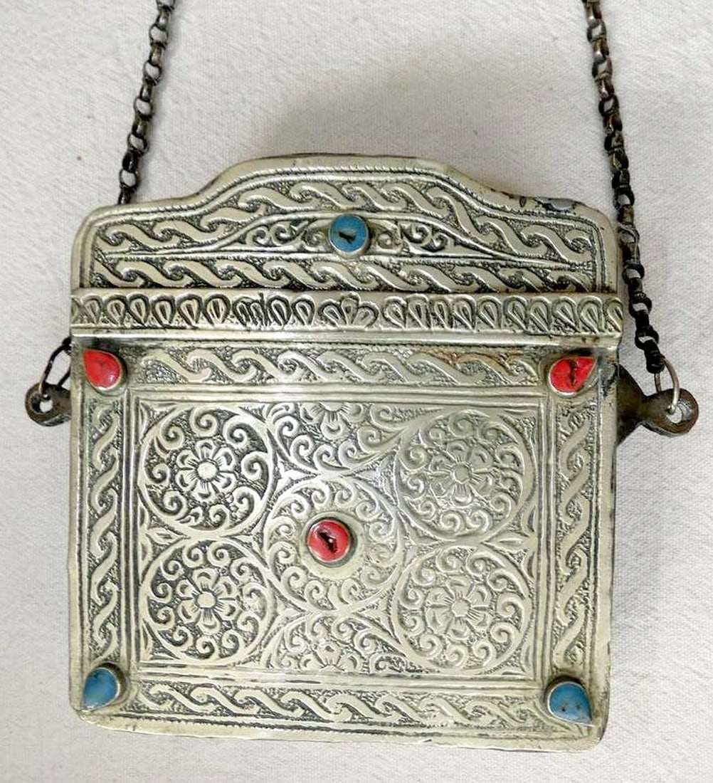 Islamic antique mixed metal: low grade silver and copper engraved Quran amulet box bag with Arabic: Islamic antique mixed metal: low grade silver and copper engraved Quran amulet box bag with Arabic calligraphy, set with coral and turquoise, North Africa, 19th cen. One hinge to lid is missing Hamd c