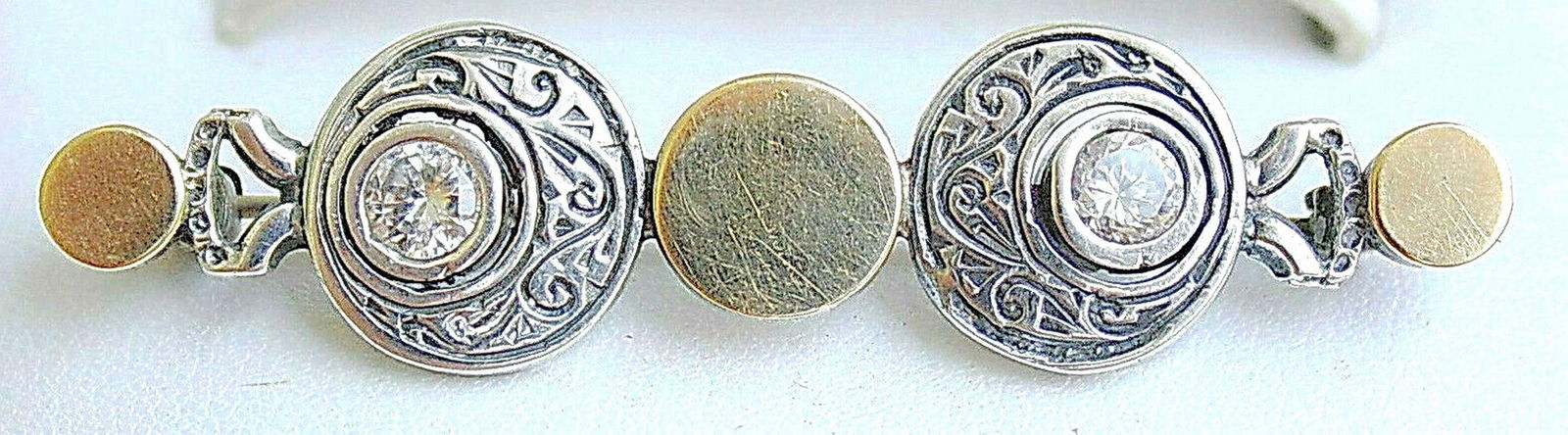 Vintage silver sterling 925 and rolled gold engraved pin brooch set with faceted zircon.: Vintage silver sterling 925 and rolled gold engraved pin brooch set with faceted zircon. Hand crafted, engraved, hammered Size: 50 x 14 mm. ( 1.9 x 0.5 inches) Light wear