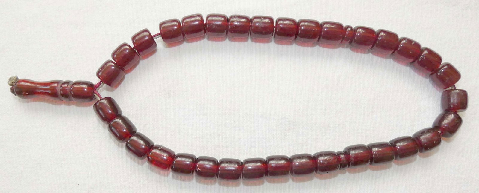 mishbaha Turkey Ottoman Islamic antique Cherry Faturan 33 prayer beads, weight: 47gr.: Misbaha Turkey Ottoman Islamic antique Cherry Faturan 33 prayer beads, weight: 47gr. Diameter of bead – 11 mm. (0.43 inches), Length – 10.5 mm. (0.4 inches) Some use wear, scratches Faturan, in Mi