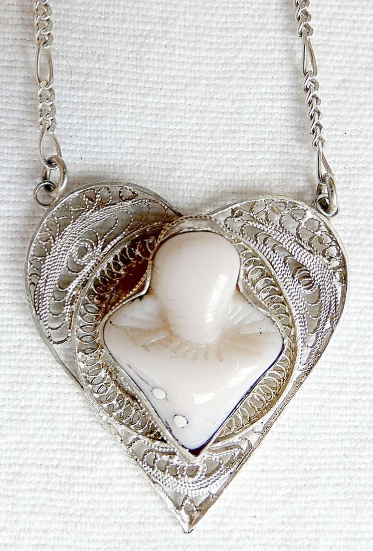 Bezalel Filigree Silver Sterling 935 heart Necklace set with Milk Glass Clown, Palestine, 1930-40: Bezalel Filigree Silver Sterling 935 heart Necklace set with Milk Glass Clown, Palestine, 1930-40 Marked: Sterling 935 Made in Palestine Length: 42 cm. (16.5 inches) Size 3.2 x 3.1 cm. (1.25 x 1.22 in