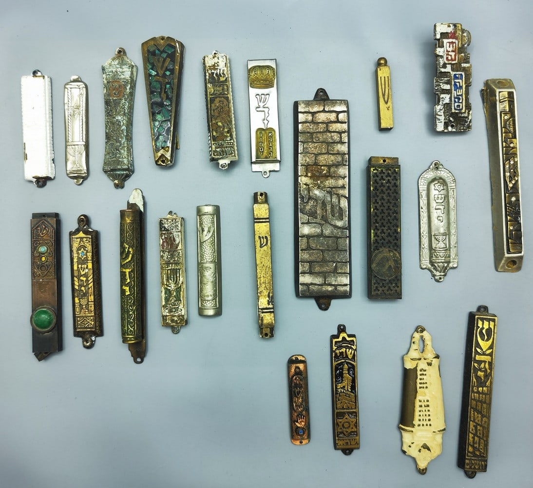 An assortment of 22 old mezuzah cases (1 of 6)