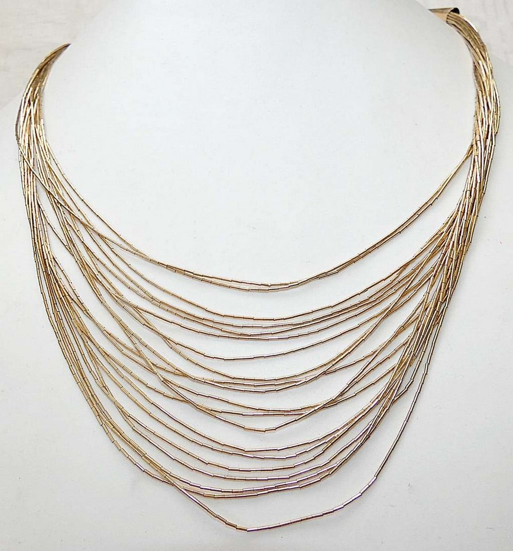 Vintage 12K GF gold filled multi strand liquid necklace.: Vintage 12K GF gold filled multi strand liquid necklace. Total length to neck: 48 cm. (18.8 inches) Length of central part: 35 cm. (13.7 inches) The necklace chain is a liquid style made of many short