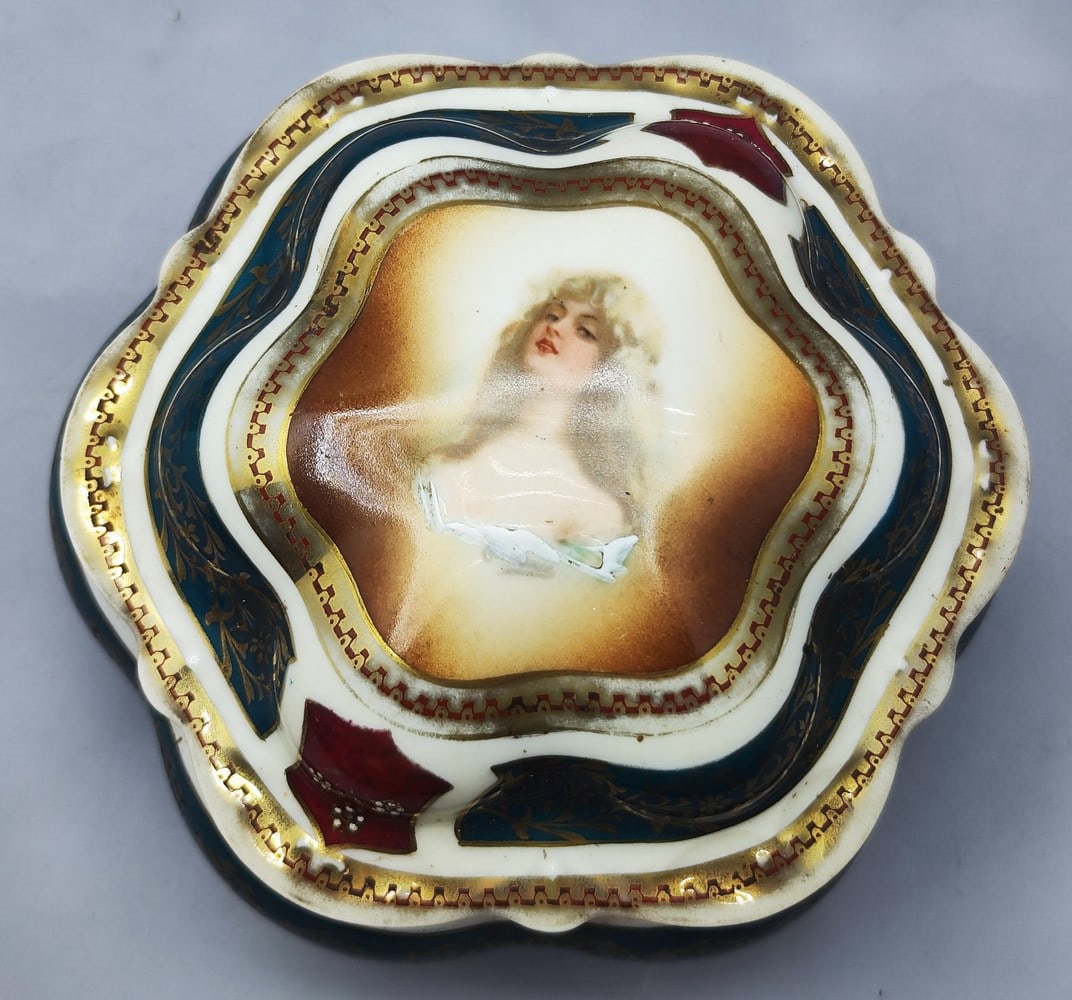 Viennese style porcelain box made by Moritz Zdekauer: Viennese style porcelain box made by Moritz Zdekauer, Austria, circa 1900, decorated with a lid with a colorful print of a woman's figure, and around gilded plant decorations on a green-pink and white