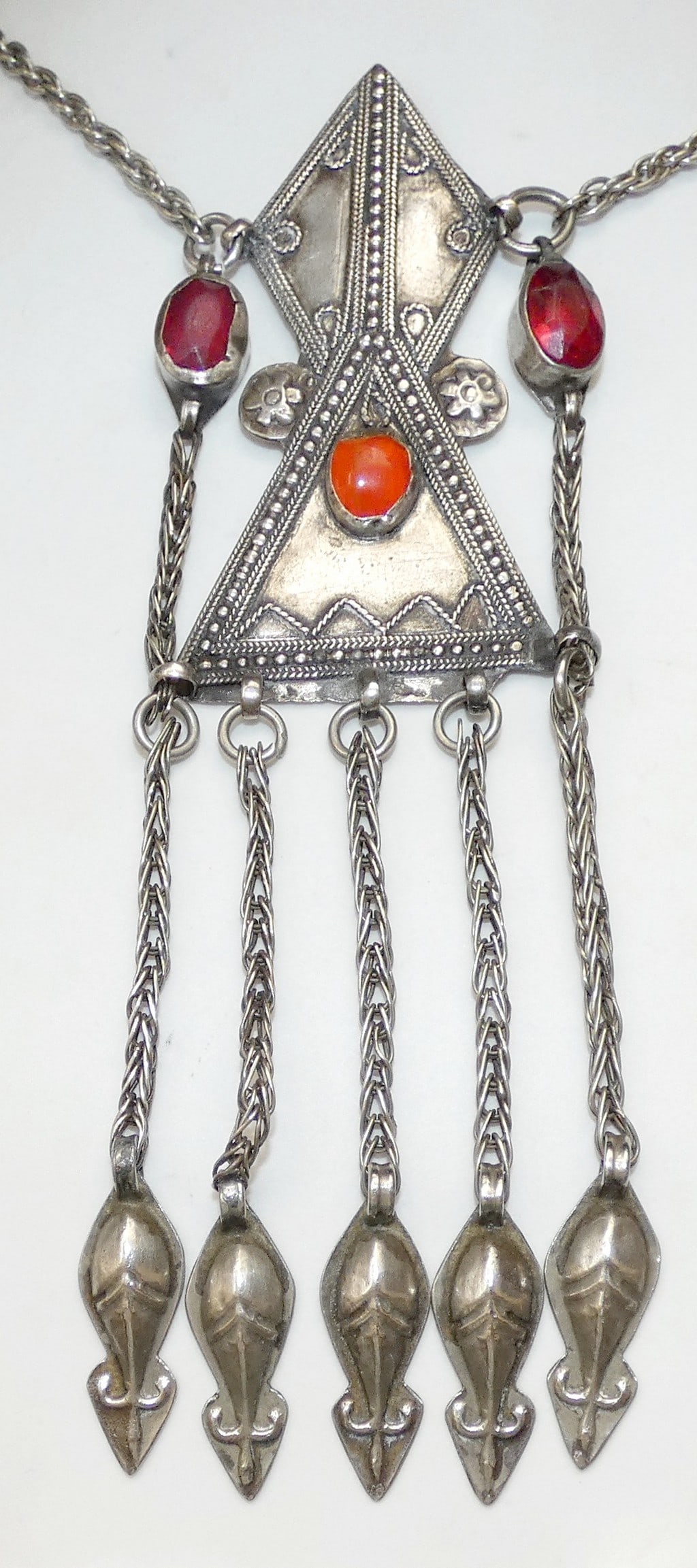 Tekke Turkmen Islamic Antique ethnic filigree silver amulet necklace set with red glass stone, 39gr.: Tekke Turkmen Islamic Antique ethnic filigree silver amulet necklace set with red glass stone, 39gr. HAND CRAFTED. FILIGREE TESTED FOR SILVER BY ACID. SIZE OF PENDANT: 14.5 x 4.5 cm. (5.7 x 1.7 inches